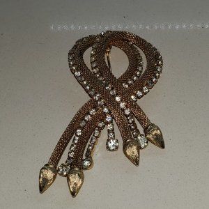 GOLD TONE BRAIDED PIN TRIMMED IN RHINESTONES